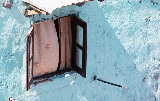 Open window blue wall, the city of Antananarivo