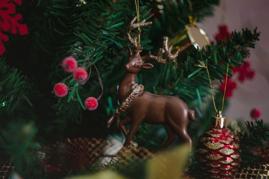 Elk and deer on the holiday tree, Christmas toy, life style.