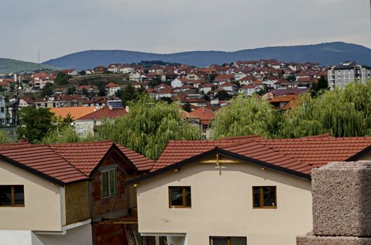 A residential district of contemporary macedonian  houses in  town Delchevo among Maleshevo and Osogovo mountains