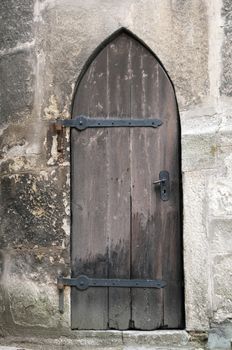 Detailed view of a medieval gothic castle door.