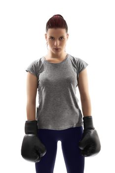 Young girl with boxing gloves under harsh light