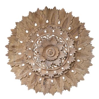 Wooden pattern of flower on carve teak wood in circle shape.