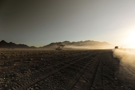 Endless empty dirt road in Namib desert of Namib-Naukluft Nation