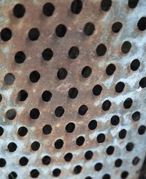 on the background of the old grater. Rusty metal