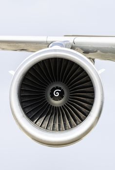 Jet engine on the airplane wing. Close-up frontal view of the je