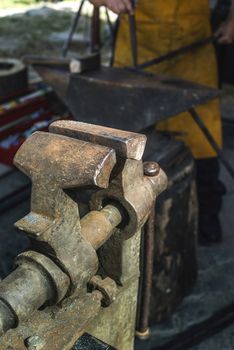 Vise and anvil in a forge shop