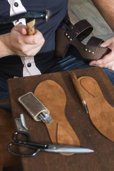 Hands making shoes