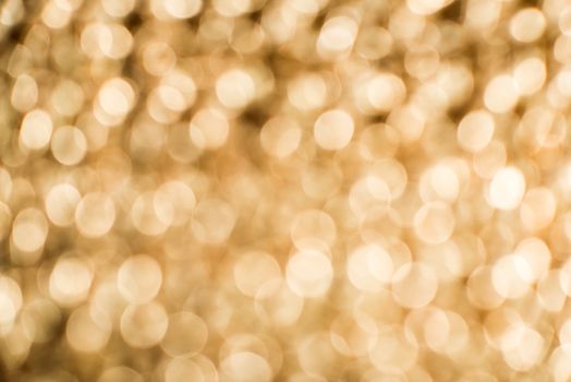 Gold color shiny ornaments bokeh. Blurred background
