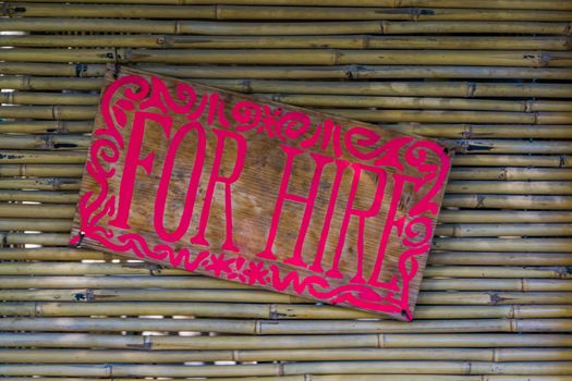 For hire sign on a bamboo wall, Real estate for rent background