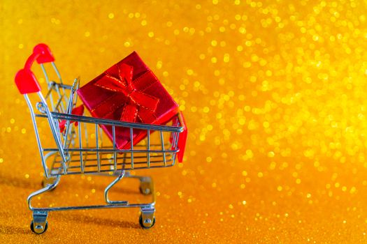 Christmas golden background. Christmas present in a supermarket 