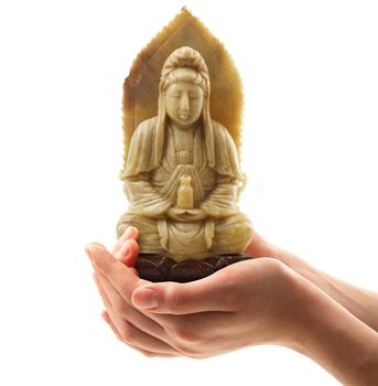 Statue of Buddha held in hand on white background