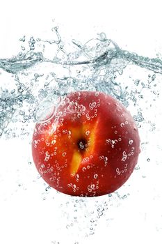 peach falling in water