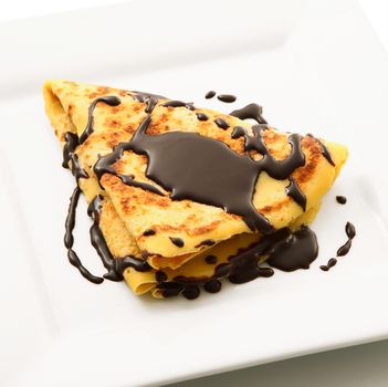 crepes with chocolate in white background