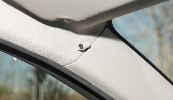 Car interior with closeup of anti-theft alarm sensor
