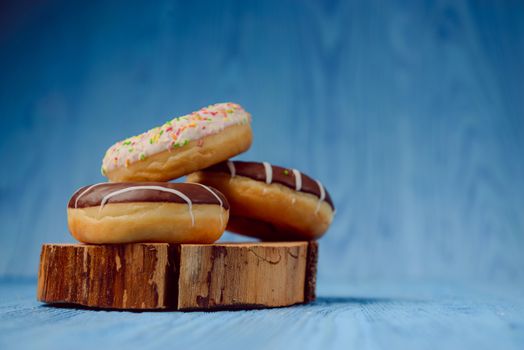 donuts lying on the table. blue background