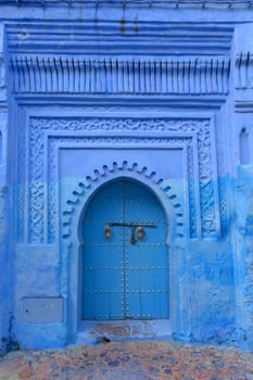 Typical door in blue city of Chefchaouen Morocco