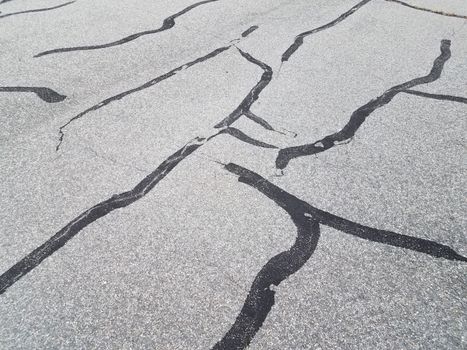 black asphalt with tar to repair damaged ground