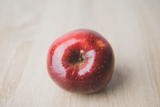 One ripe red apple. Isolated on a white background.
