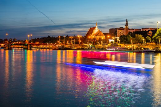 Szczecin. Night view from across the river to the illuminated hi