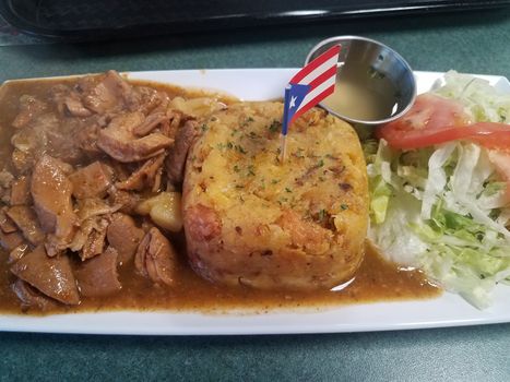 stomach and plantain and Puerto Rico flag on plate