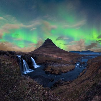 Green Aurora Borealis over Kirkjufell in Snaefellsnes in Iceland