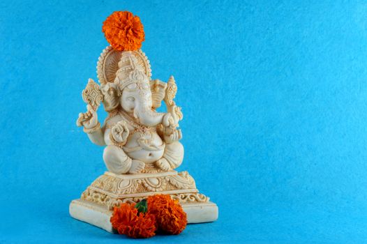 Hindu God Ganesha. Ganesha Idol on blue background