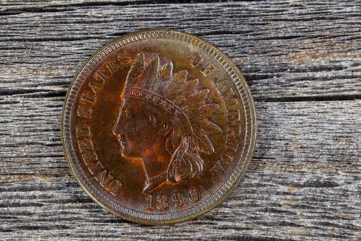 Indian Head Cent in uncirculated condition on old wood 