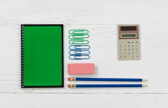 Organized supplies for work or school on white desktop