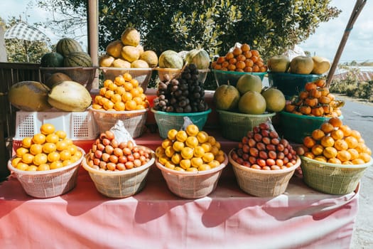 tropical fruits in baskets on fruit market