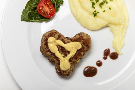 heart shaped meat loaf on a plate