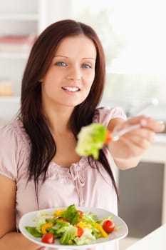 Woman offering salad