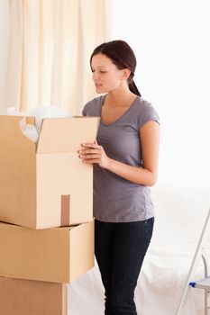 Woman packing a cardboard