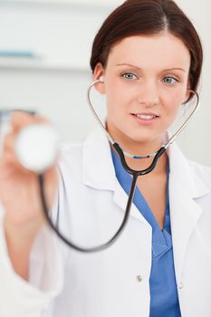 Female doctor using stethoscope