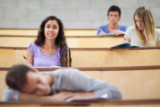 Students listening while their classmate is sleeping