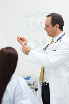 Doctor preparing an injection
