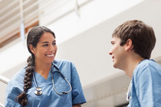 Female nurse talking with a male nurse