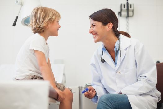 Doctor smiling to a child