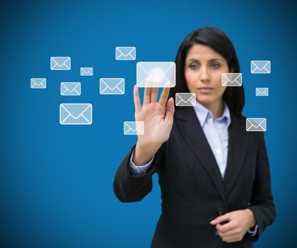 Concentrate businesswoman touching at a message symbol 