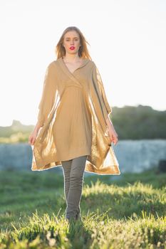 Attractive blonde woman wearing poncho
