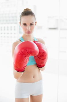 Sporty stern woman boxing