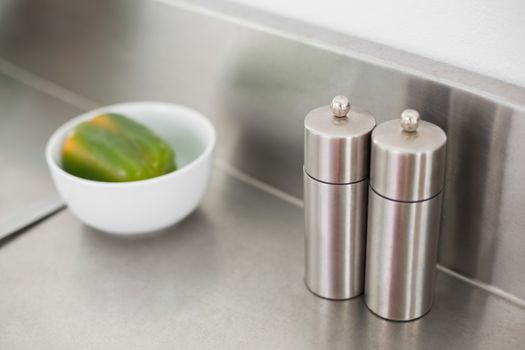Salt and pepper on a chrome counter