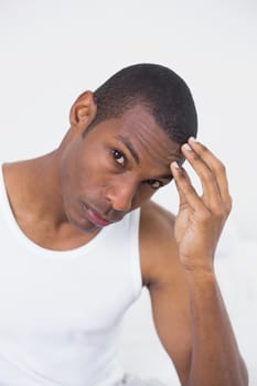 Portrait of an Afro man suffering from headache