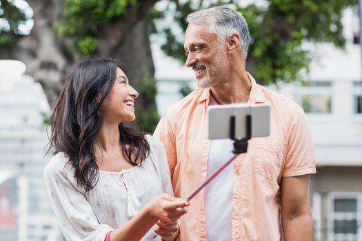 Couple looking each other while taking selfie