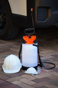 Insecticide sprayer on pavement