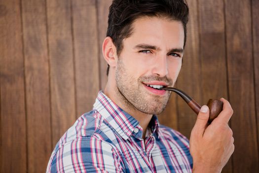 Young man smoking pipe