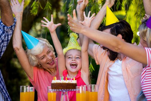 Cheerful family celebrating birthday at yard 