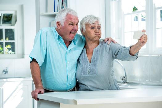 Retired couple making faces 