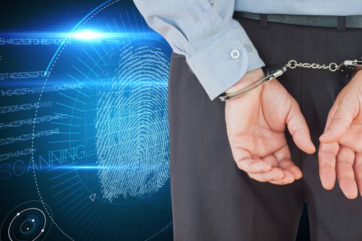 Composite image of businessman in formals with handcuffs