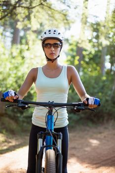Woman unsmiling posing with her bike