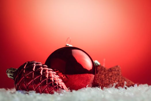 Composite image of Christmas bauble and pine cone